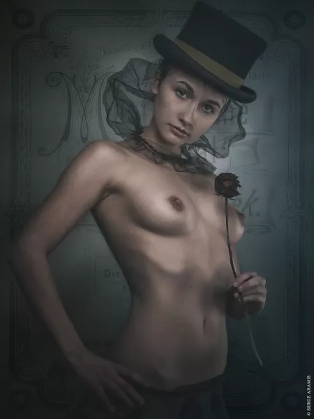 The ring-mistress beckons toward dark delights The ring-mistress beckons toward dark delights