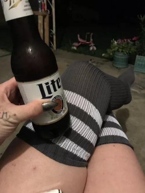 Thigh highs, a beer, good nails and hand tats. Iโm hot even without my face in the pic ๐