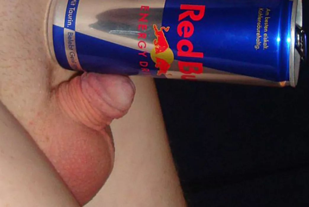 Tiny penis halfway hard compared to little Red Bull can. 