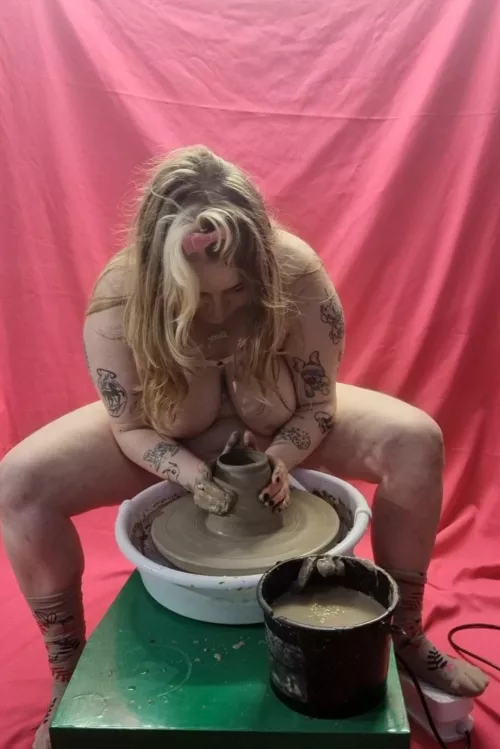 Topless on the pottery wheel, muddy and messy!