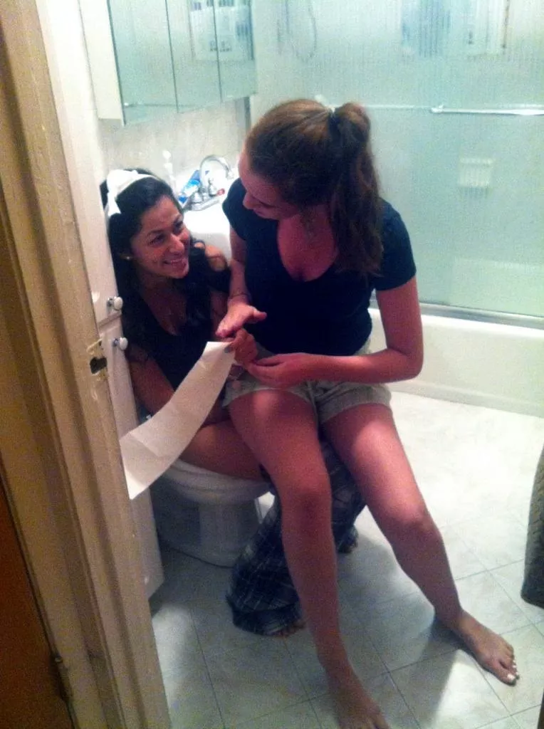 Two girls, one toilet Two girls, one toilet