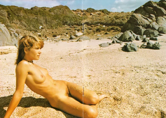 Vintage: Alone on the beach, lost in her thoughts, watching the sea...