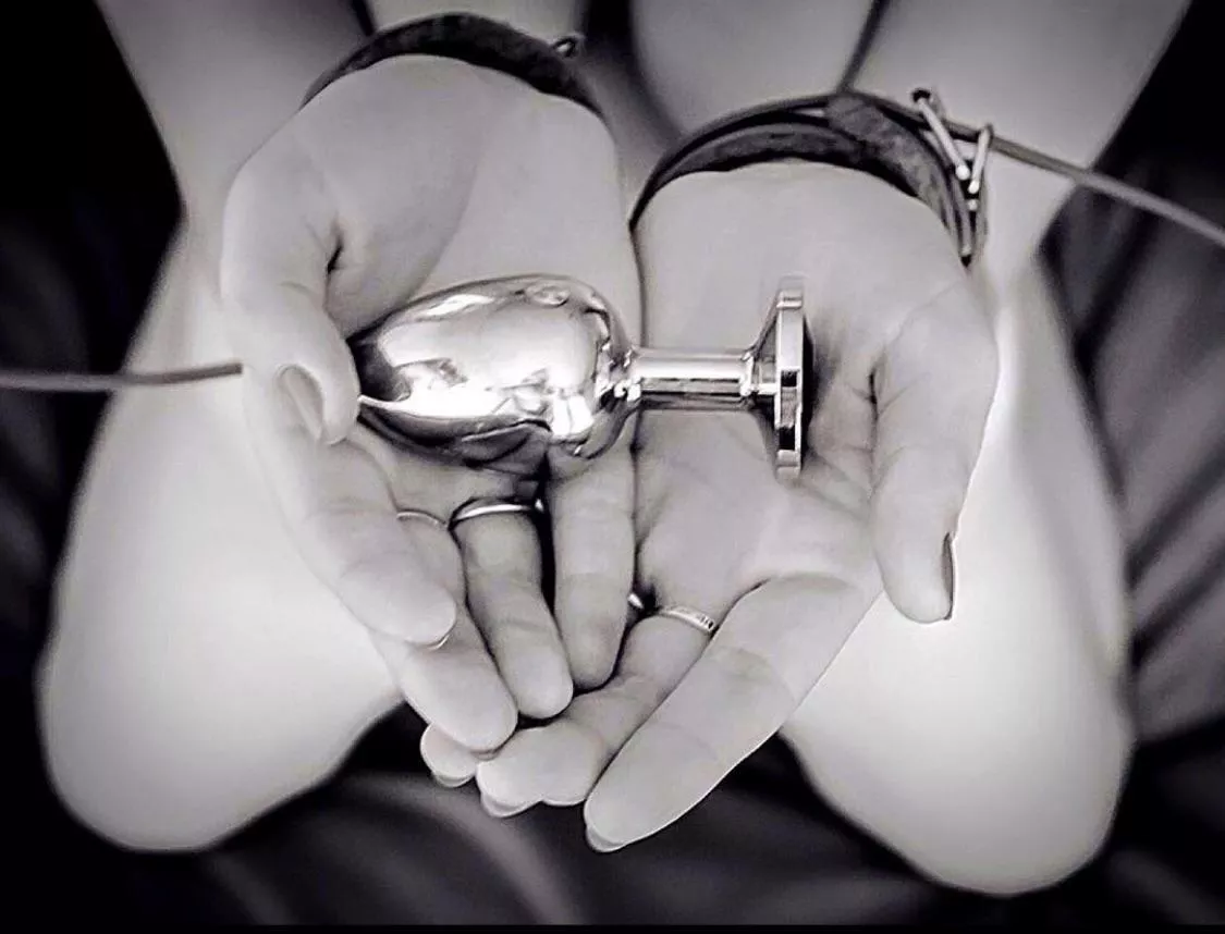 Waiting for her master to cuff and plug her. Waiting for her master to cuff and plug her.