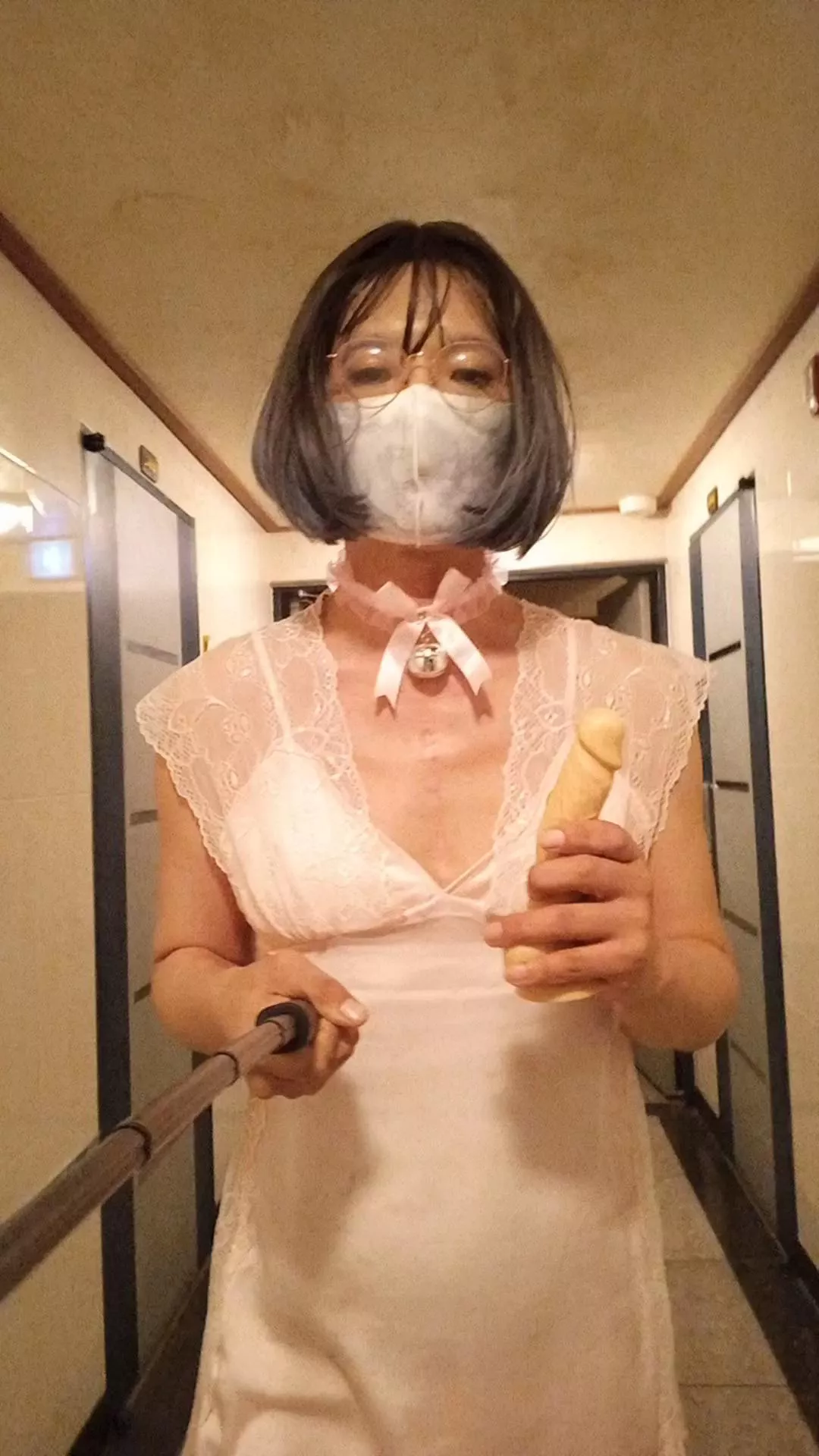 Walking down the hallway with a dildo in lingerie