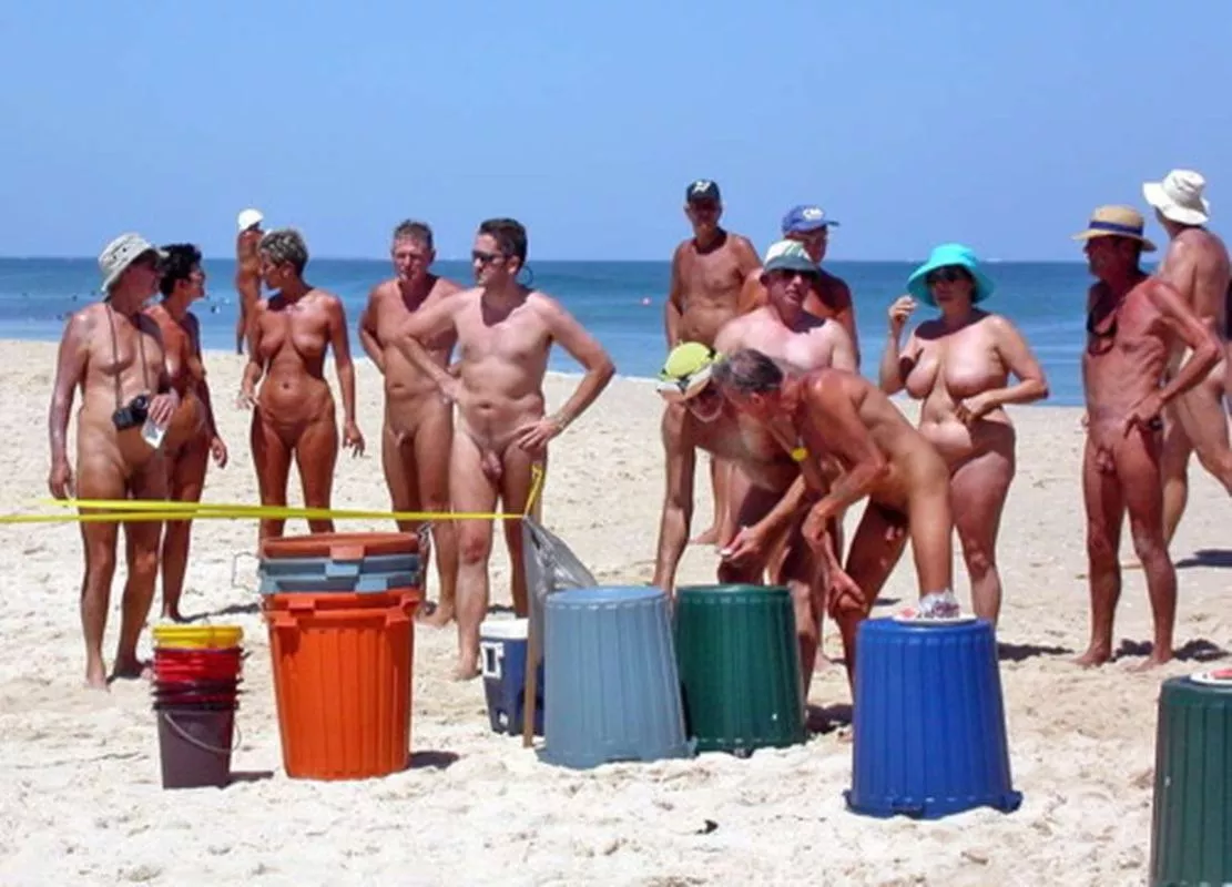 What a crowd of elderly people could be doing with a stack of trash bins? What a crowd of elderly people could be doing with a stack of trash bins?
