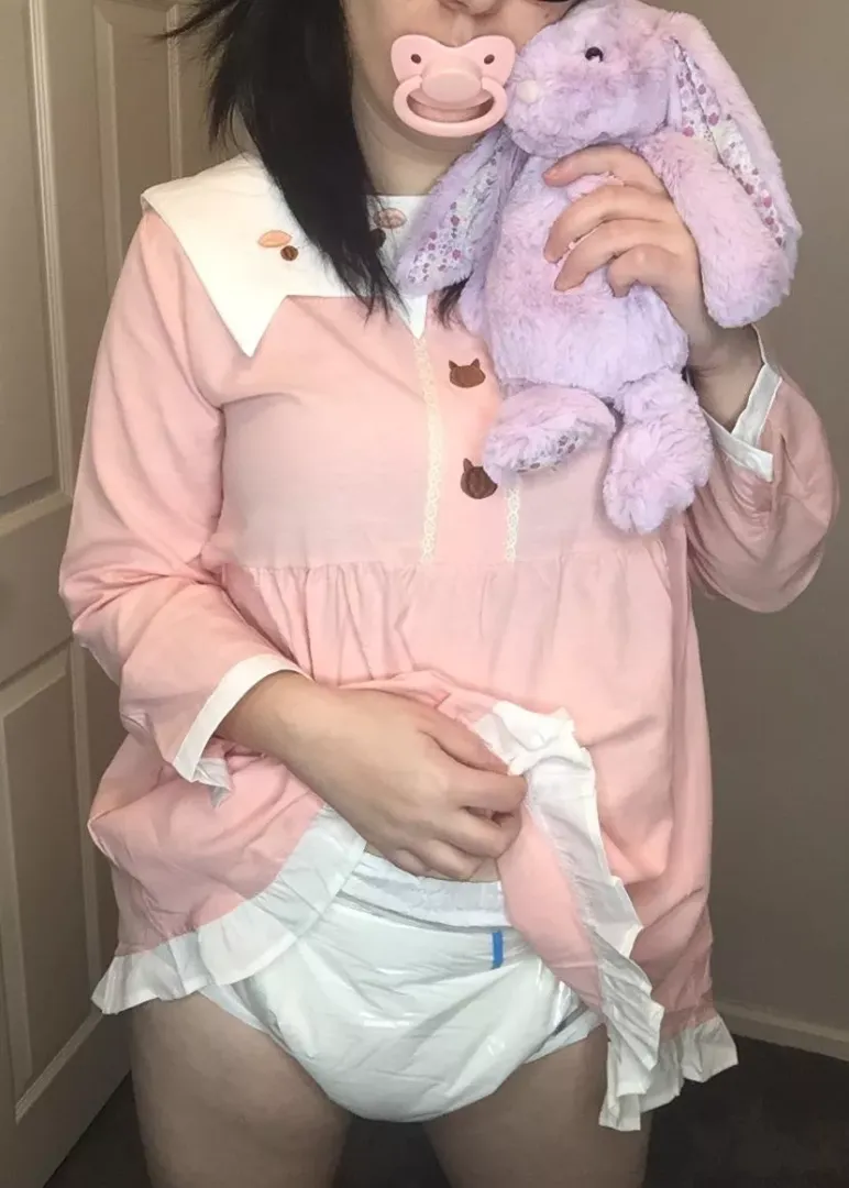 White diapers, pink dress