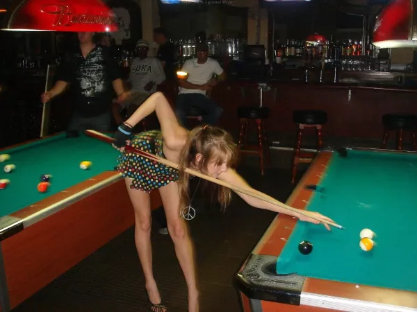 Wife at the bar, playing pool Wife at the bar, playing pool