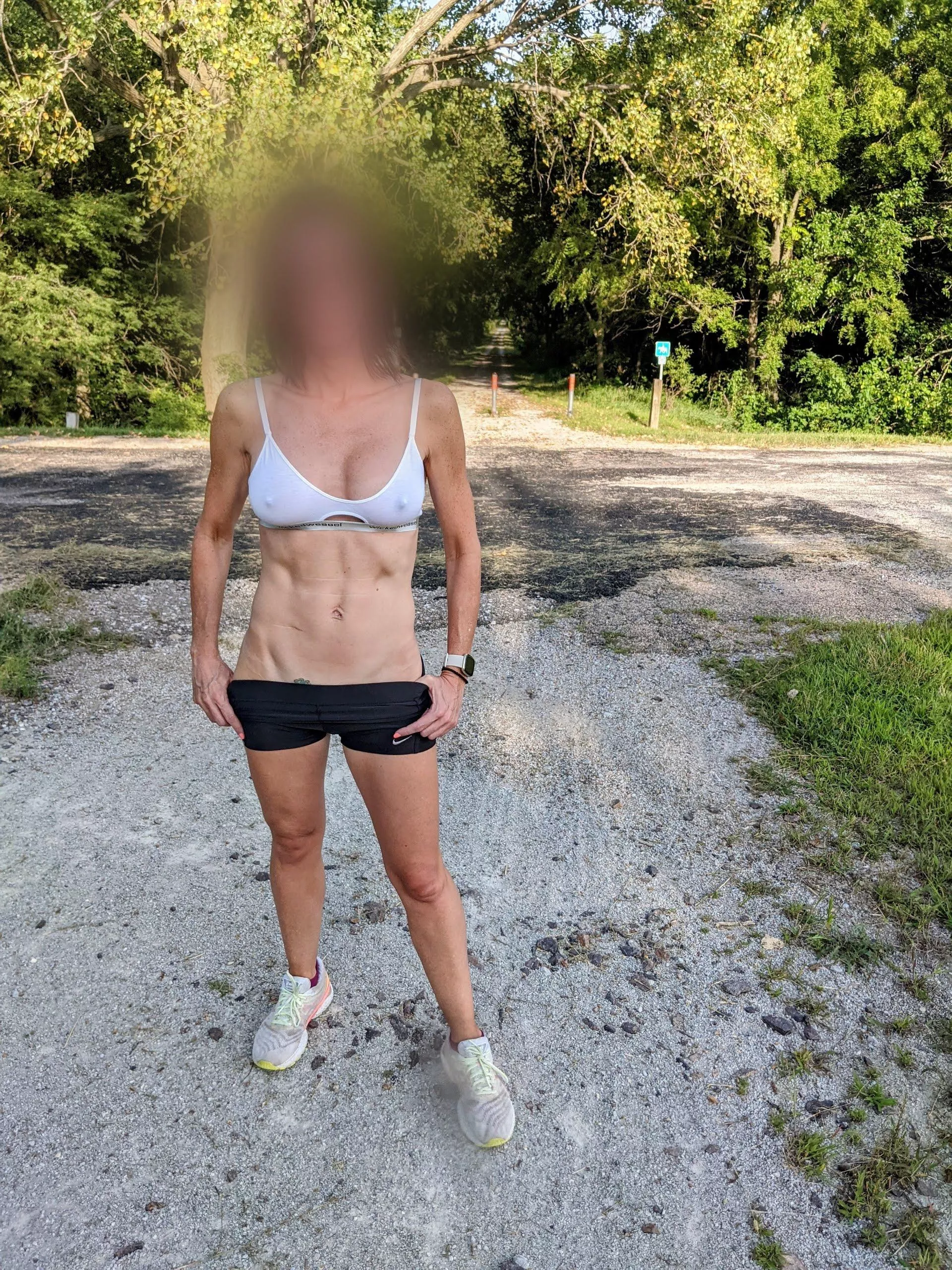 Wife's thin sports bra on the local running trail Wife's thin sports bra on the local running trail