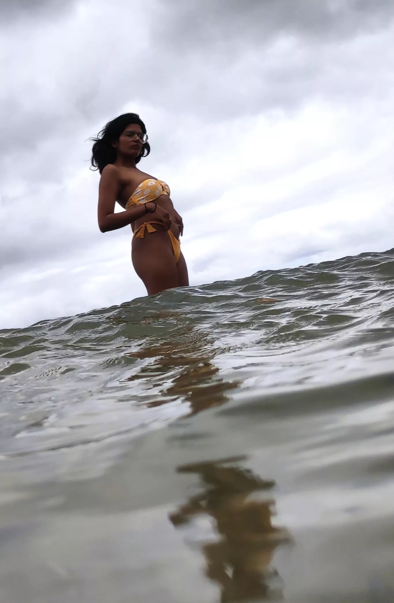 Yellow bikini and rough sea Yellow bikini and rough sea